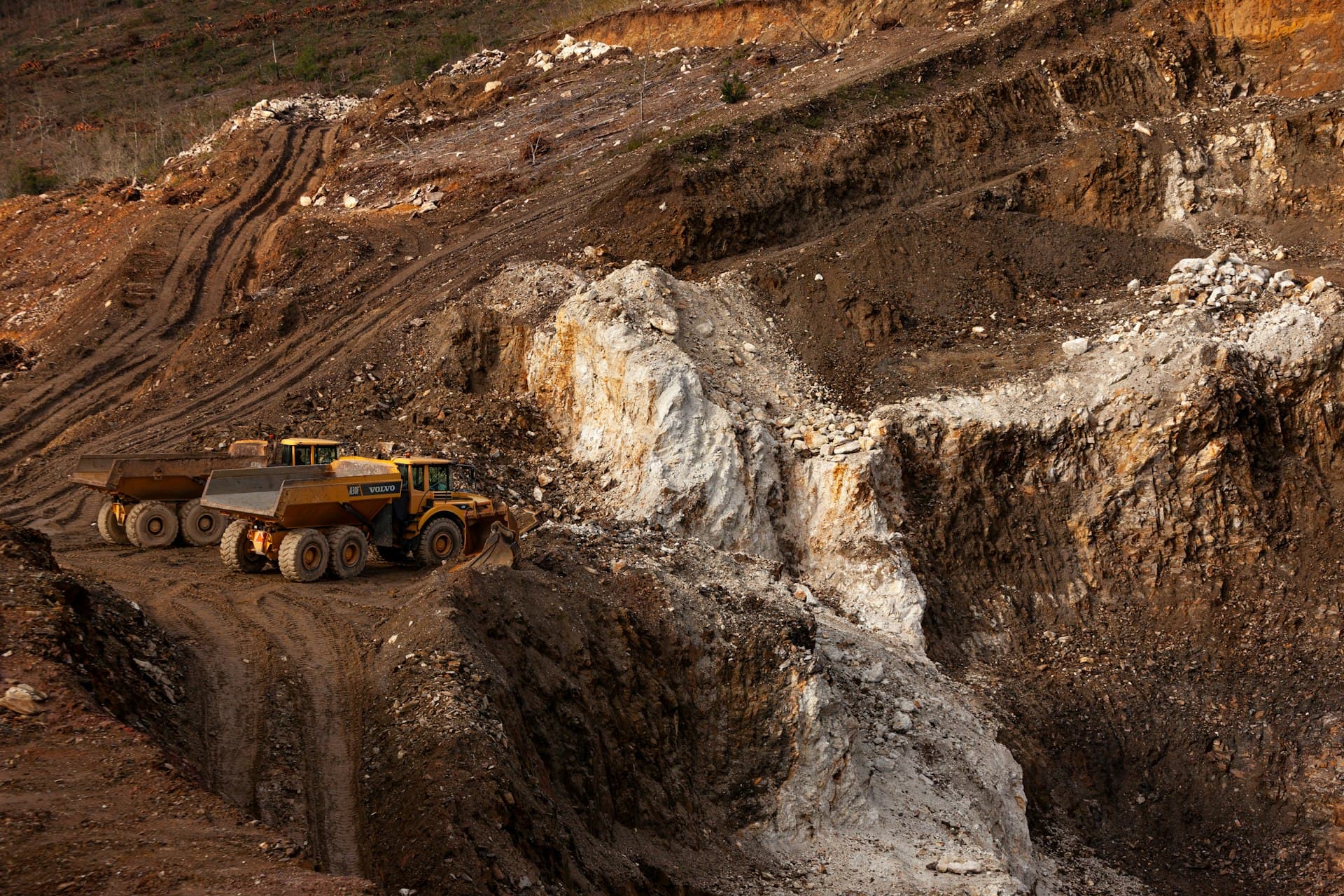 Autonomous haul truck driving through an open-pit quarry